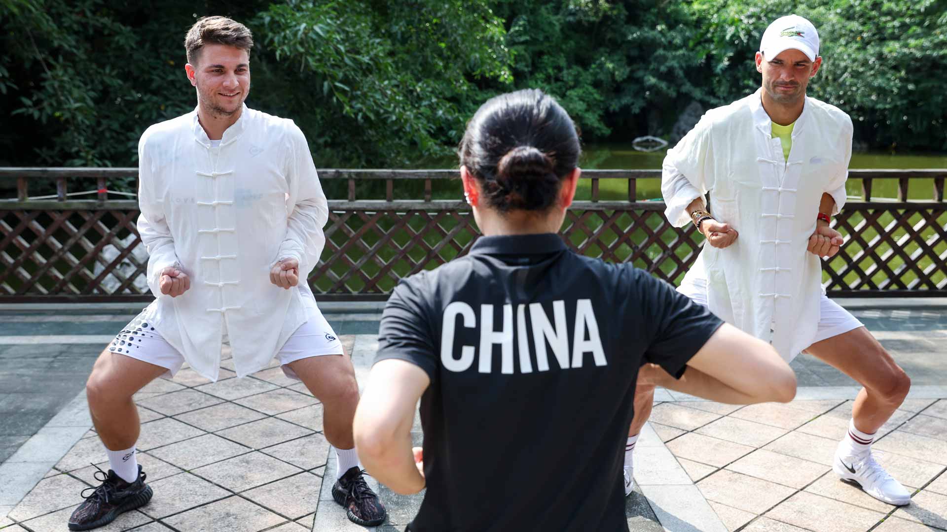 Miomir Kecmanovic (left) and Grigor Dimitrov learn kung fu in Chengdu.