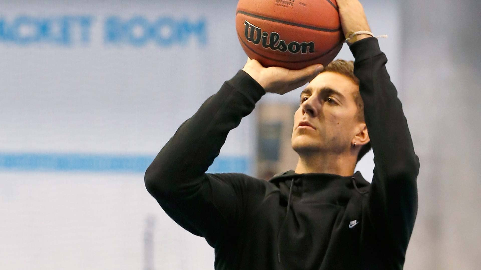 Thanasi Kokkinakis plays basketball at an event in Australia in 2017.