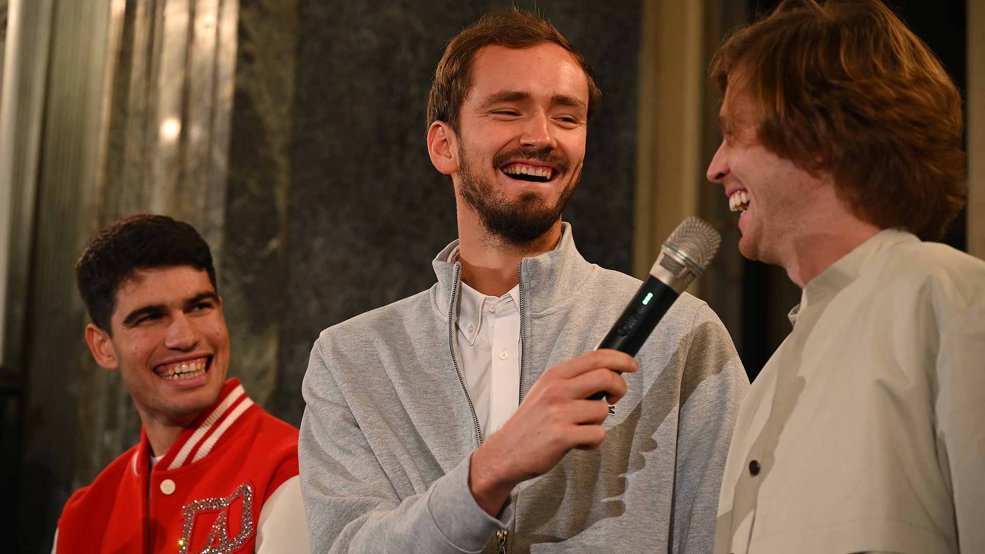 Daniil Medvedev shares a joke with close friend Andrey Rublev on media day in Turin.