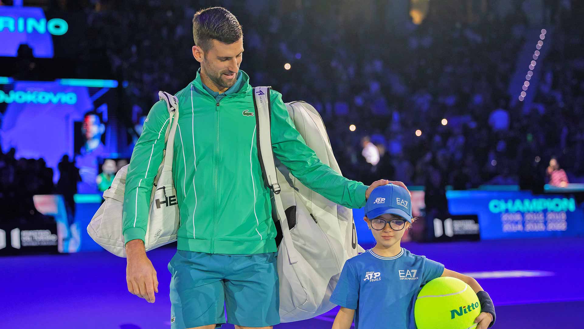 <a href='https://www.atptour.com/en/players/novak-djokovic/d643/overview'>Novak Djokovic</a> and a <a href='https://www.atptour.com/en/tournaments/nitto-atp-finals/605/overview'>Nitto ATP Finals</a> mascot