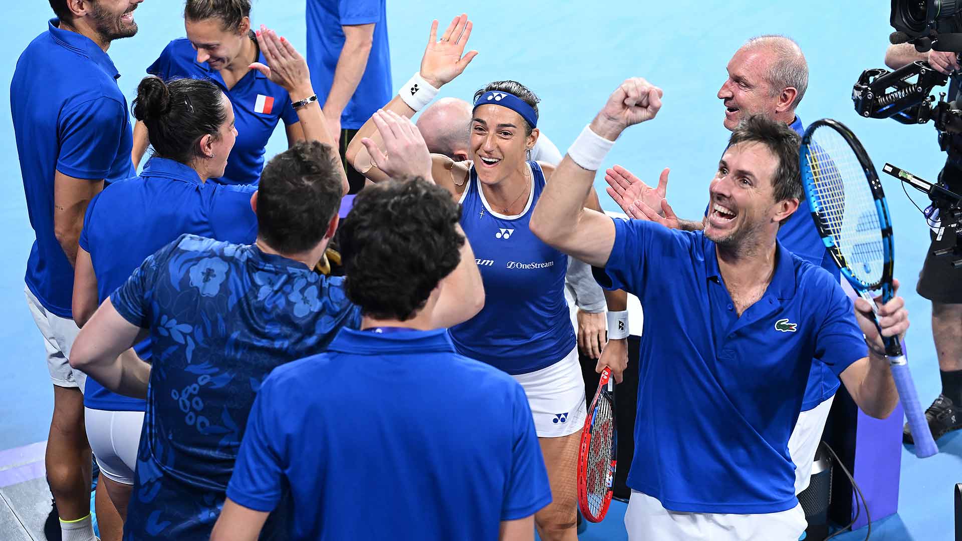 Caroline Garcia and Edouard Roger-Vasselin celebrate France's path to the United Cup semi-finals.