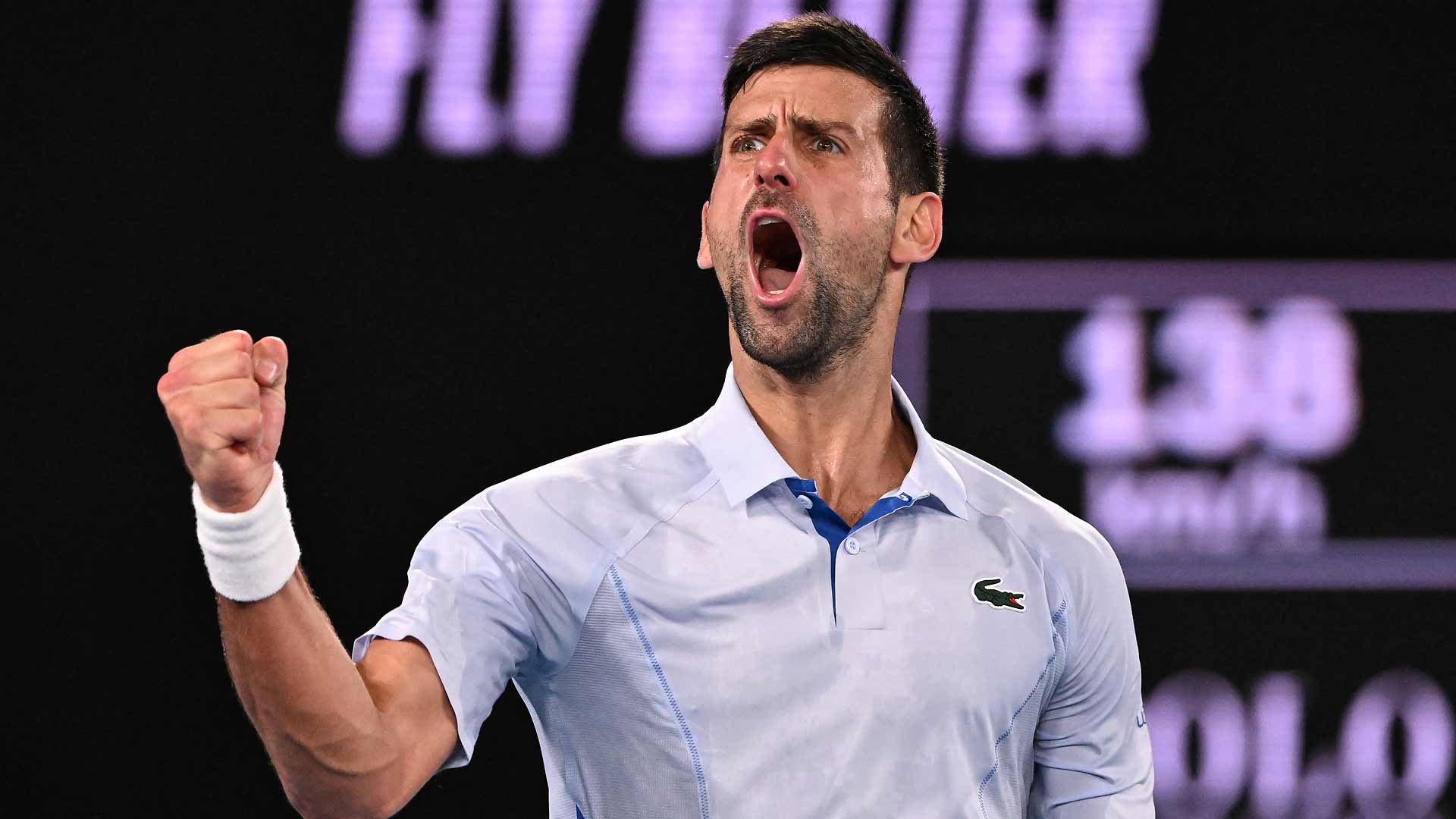 Novak Djokovic celebrates during his first-round clash against Dino Prizmic on Sunday in Melbourne.