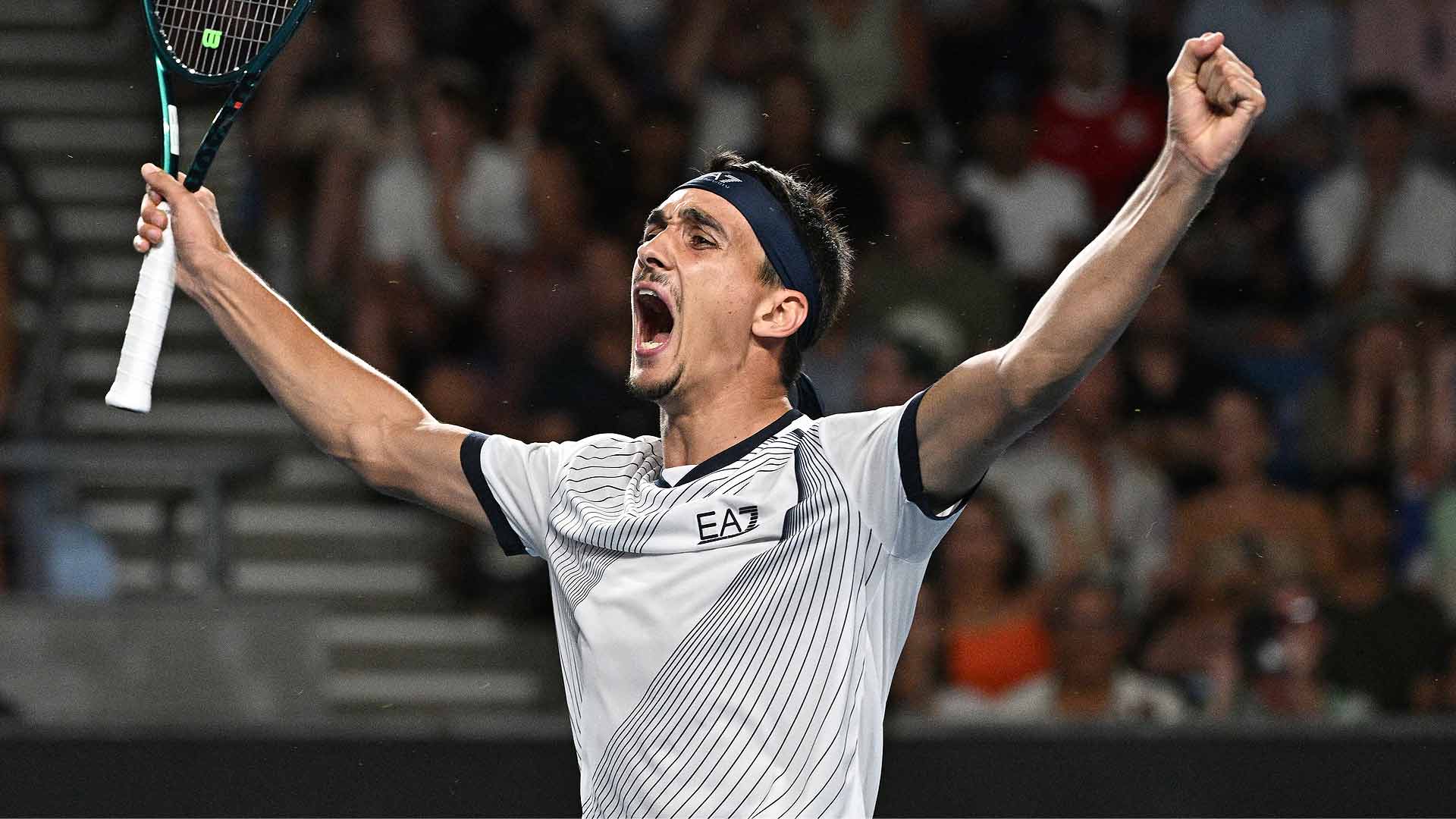 Lorenzo Sonego celebrates his first-round victory at Melbourne Park against Daniel Evans.