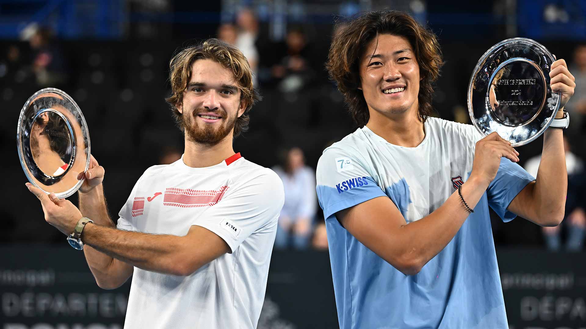 Tomas Machac and Zhang Zhizhen lift the trophy at the Open 13 Provence in Marseille.