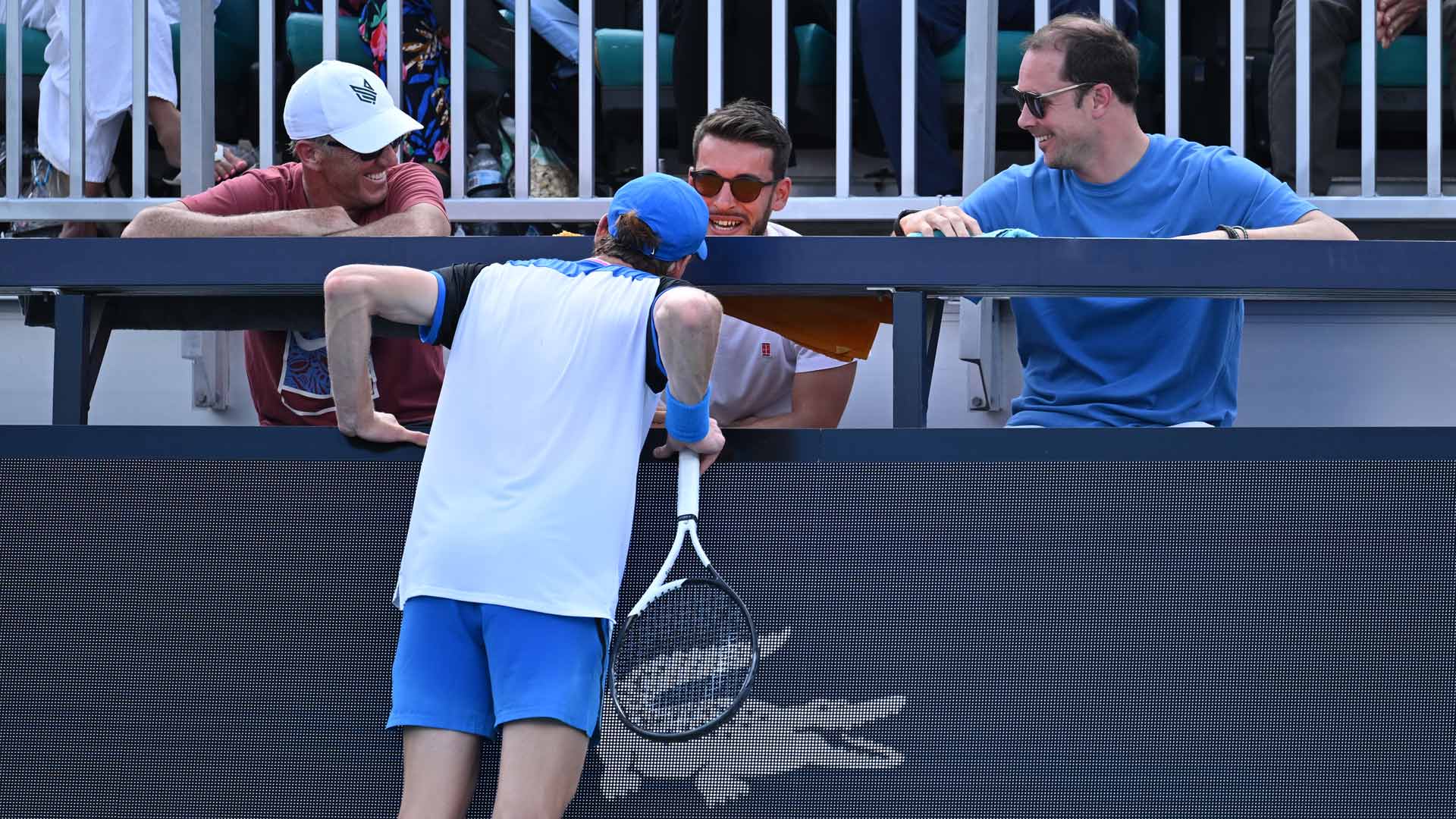 Jannik Sinner checks on physio Giacomo Naldi after accidentally hitting him with a return Tuesday in Miami.