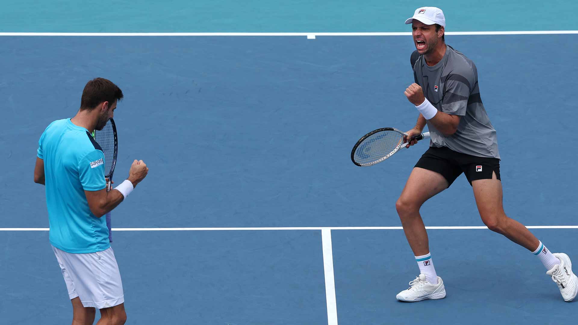 Marcel Granollers and Horacio Zeballos in action Wednesday in Miami.