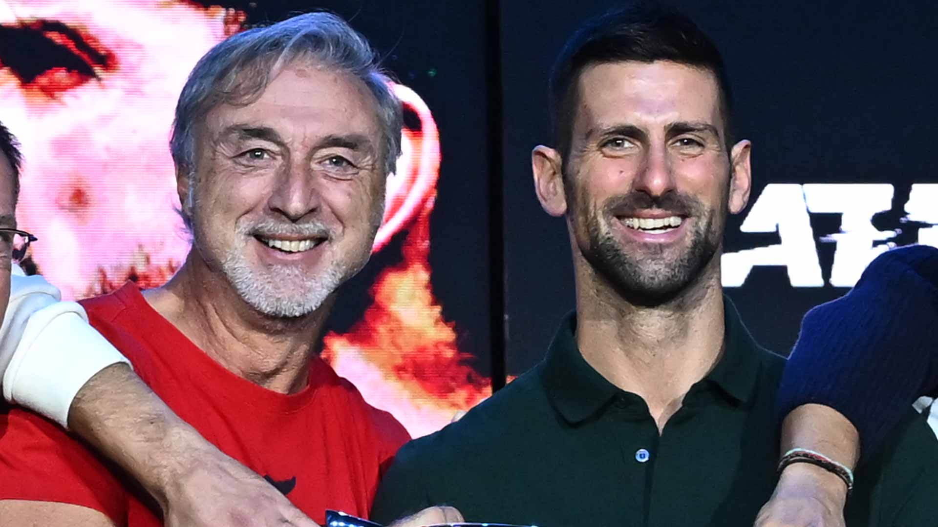 Marco Panichi celebrates with Novak Djokovic at the 2023 Nitto ATP Finals.