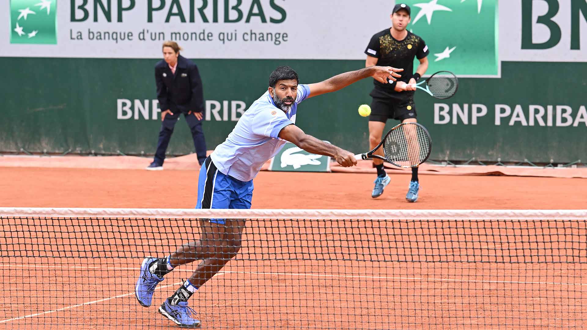 Second seeds Rohan Bopanna and Matthew Ebden advance to the Roland Garros third round after a three-set win Sunday.