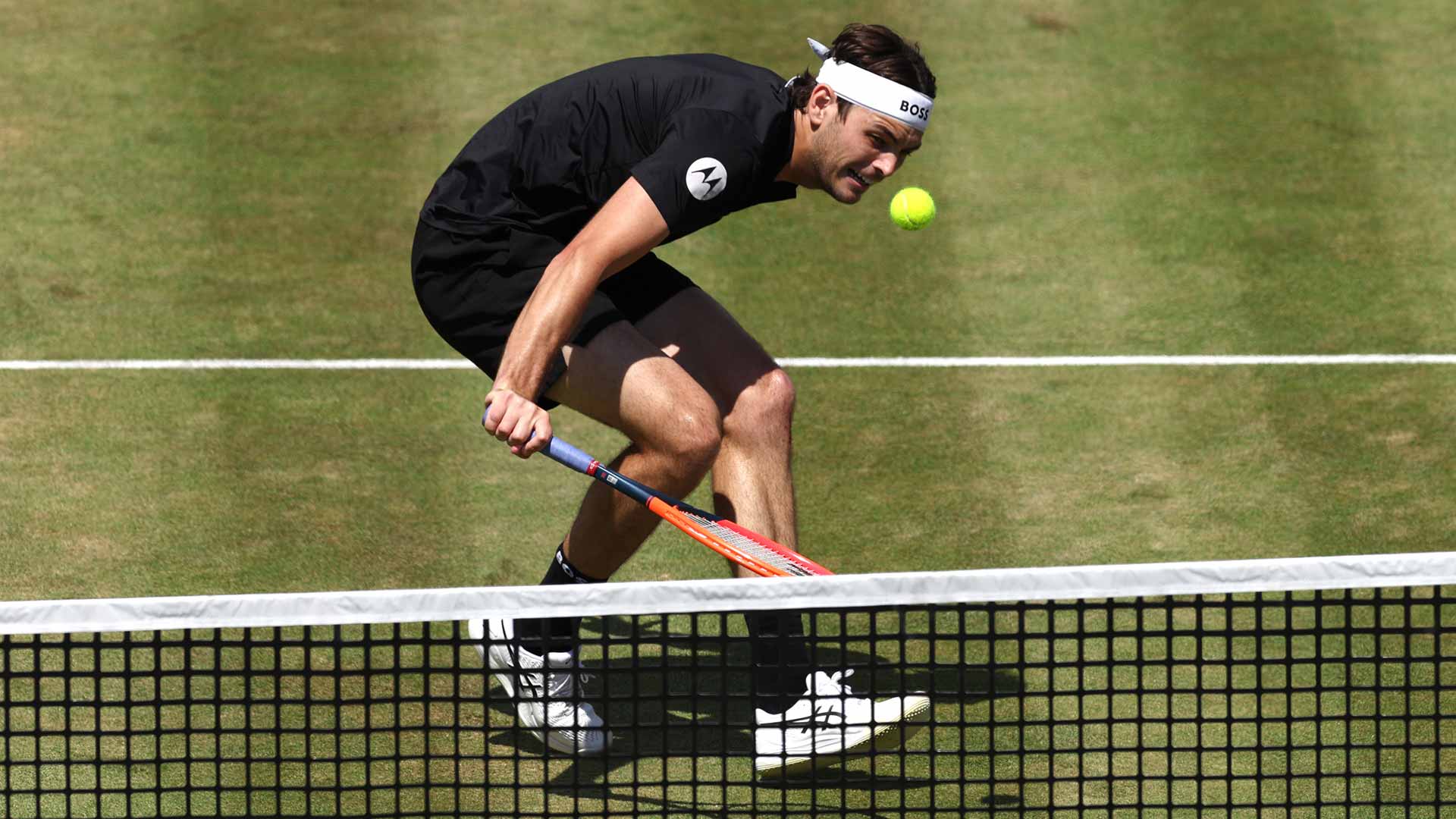 Taylor Fritz (in action) is teaming with Karen Khachanov this week in London.
