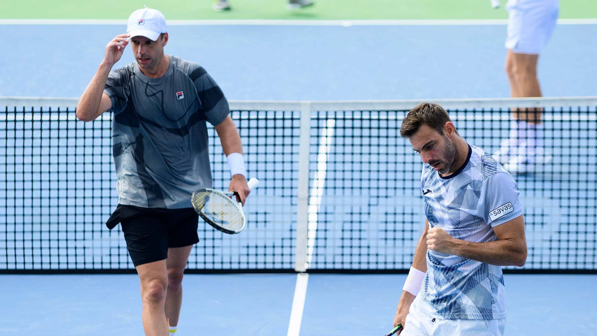Horacio Zeballos and Marcel Granollers in action in Cincinnati.