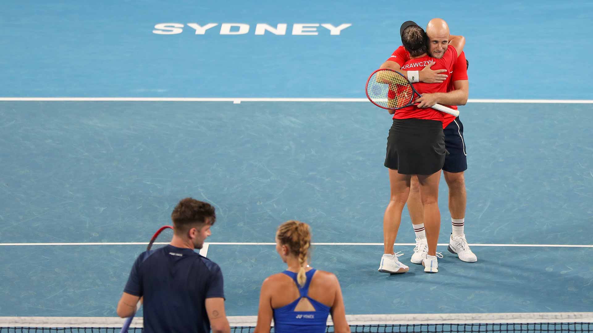 <a href='https://www.atptour.com/en/players/denis-kudla/kb09/overview'>Denis Kudla</a> hugs Desirae Krawczyk after their win on Saturday at the <a href='https://www.atptour.com/en/scores/archive/perth-sydney/9900/2025/results'>United Cup</a>.