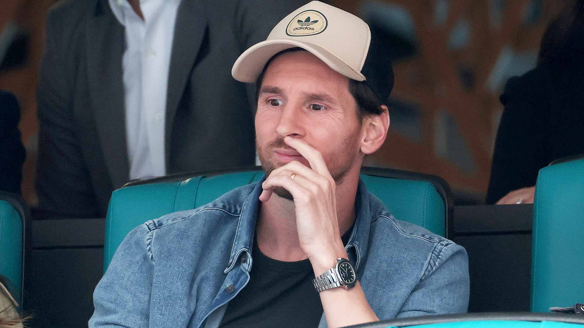 Lionel Messi watches Novak Djokovic in action on Friday in Miami.