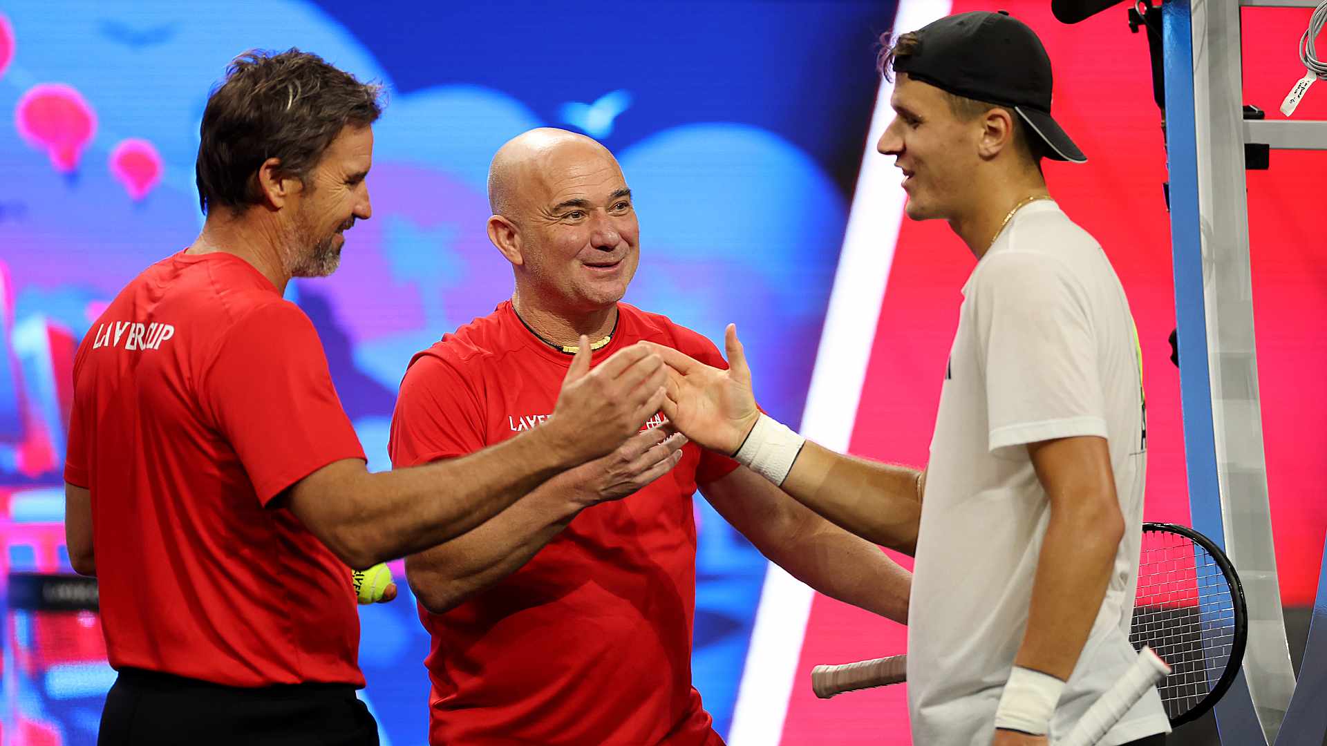 <a href='https://www.atptour.com/en/players/andre-agassi/a092/overview'>Andre Agassi</a> and <a href='https://www.atptour.com/en/players/patrick-rafter/r255/overview'>Patrick Rafter</a> with Team Europe's <a href='https://www.atptour.com/en/players/jakub-mensik/m0ni/overview'>Jakub Mensik</a>.