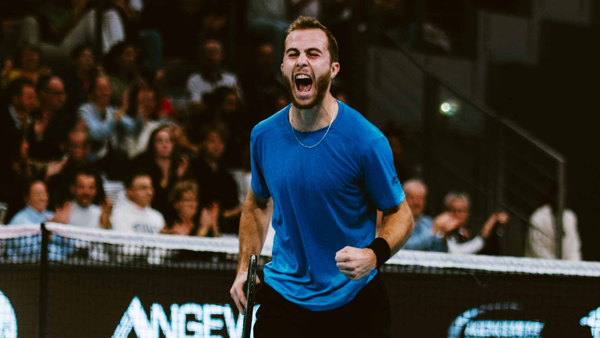 <a href='https://www.atptour.com/en/players/hugo-gaston/g09o/overview'>Hugo Gaston</a> celebrates winning the Brest Challenger. Credit: Benjamin Croizet