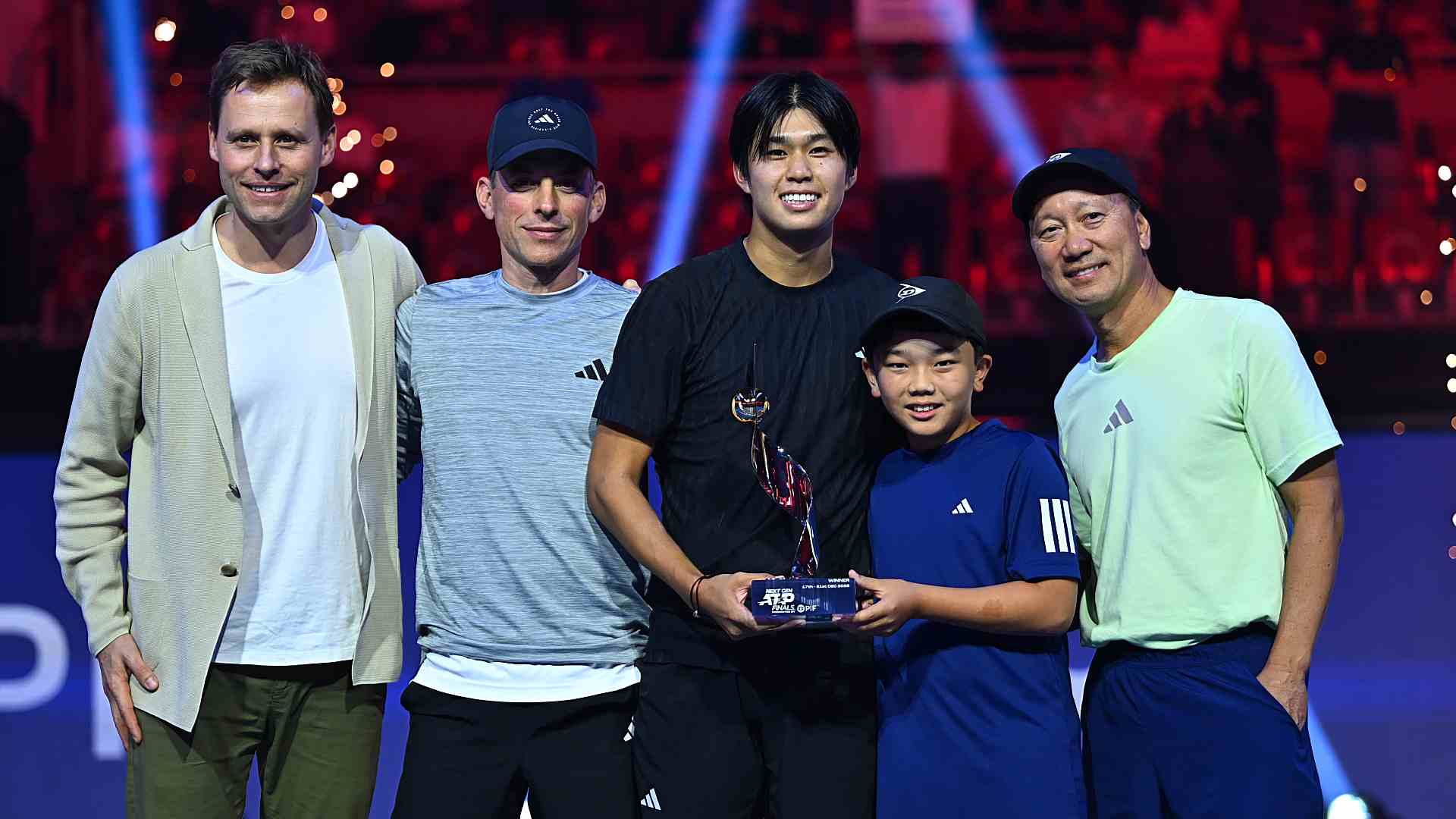 Tien with agent Mats Merkel, coaches Erik Kortland and <a href='https://www.atptour.com/en/players/michael-chang/c274/overview'>Michael Chang</a>, and Chang’s son Micah.