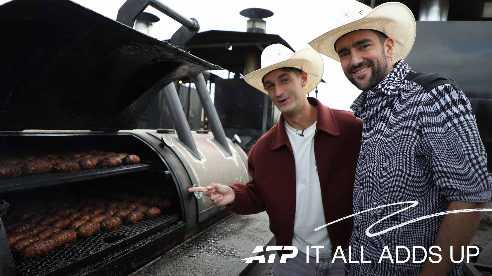 Terence Atmane and Marin Cilic learn about the art of barbecuing on Sunday in Dallas.