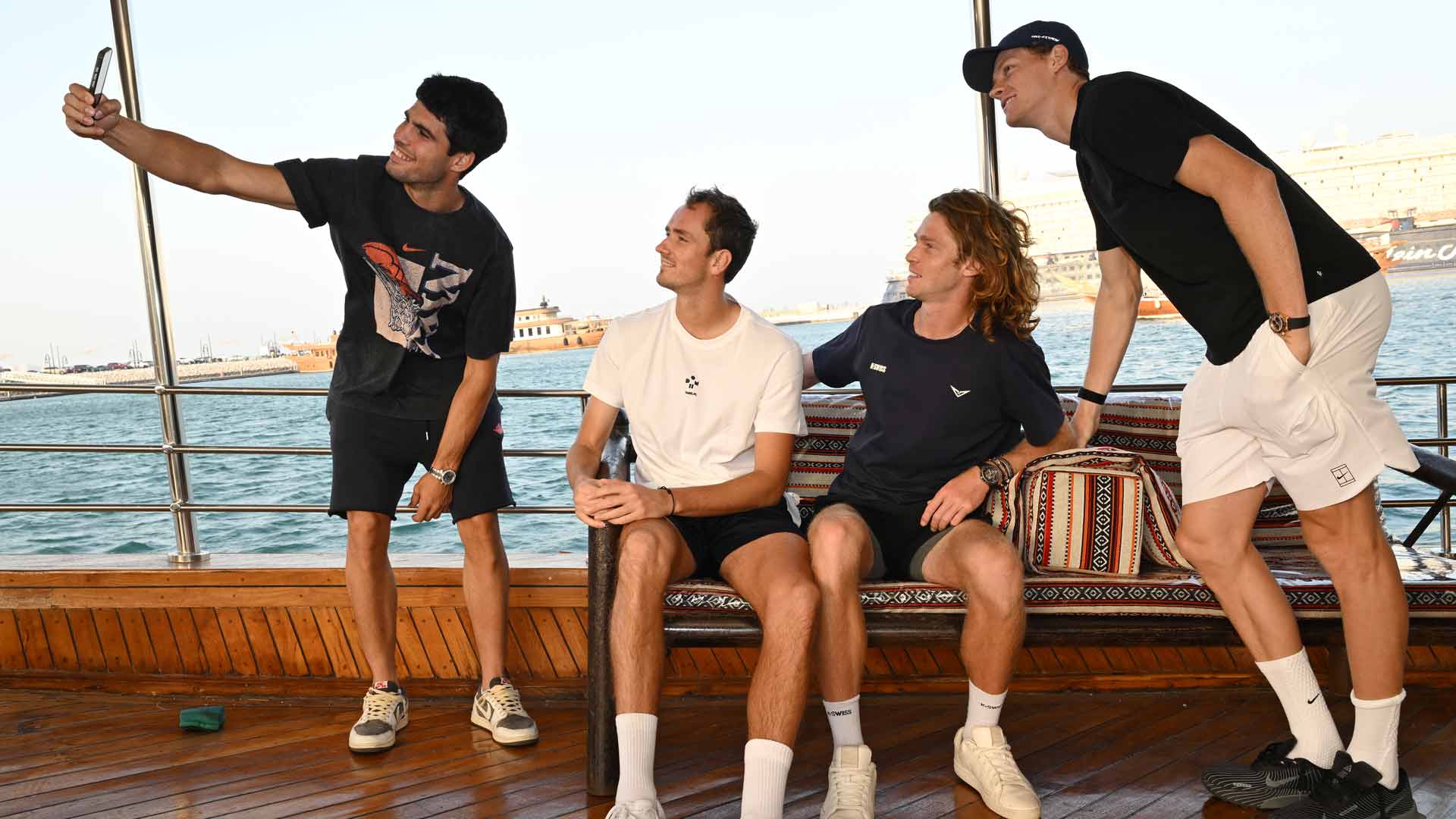 <a href='https://www.atptour.com/en/players/carlos-alcaraz/a0e2/overview'>Carlos Alcaraz</a>, <a href='https://www.atptour.com/en/players/daniil-medvedev/mm58/overview'>Daniil Medvedev</a>, <a href='https://www.atptour.com/en/players/andrey-rublev/re44/overview'>Andrey Rublev</a> and <a href='https://www.atptour.com/en/players/jannik-sinner/s0ag/overview'>Jannik Sinner</a> take a selfie on a fishing boat Sunday in Doha.