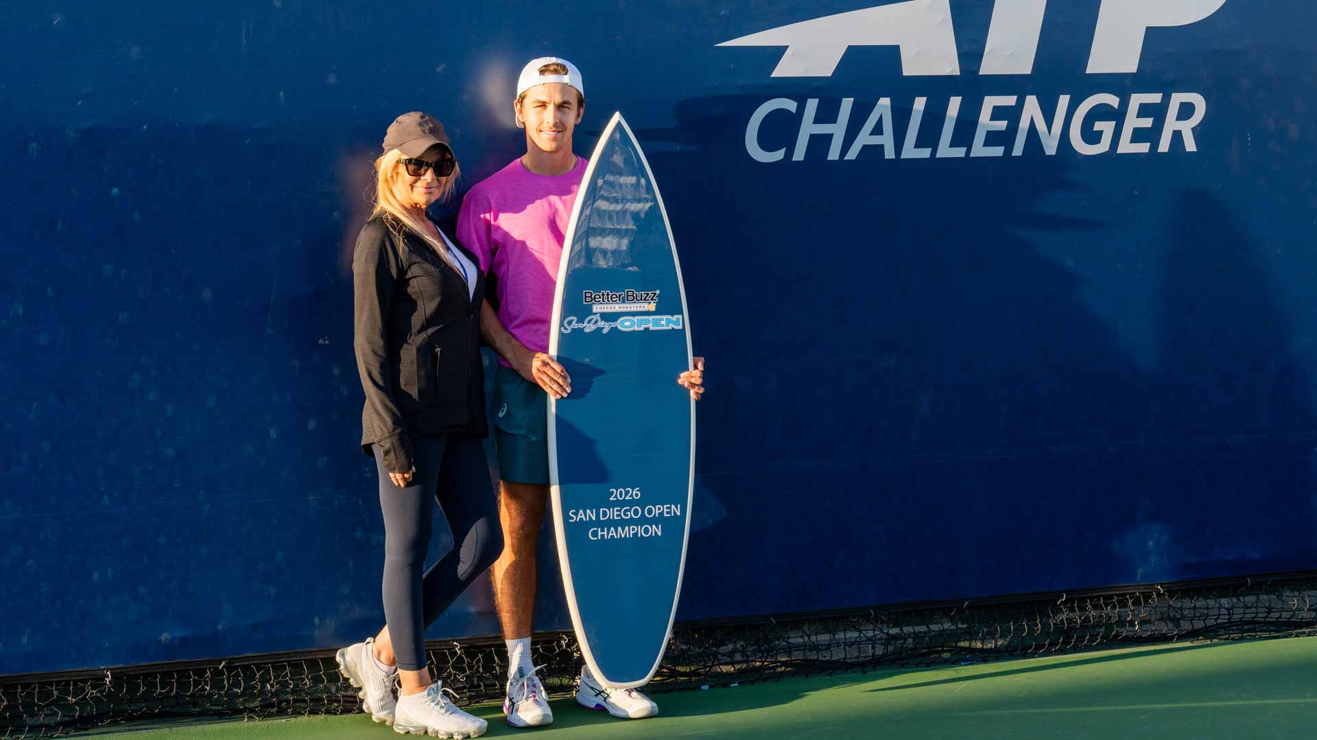 <a href='https://www.atptour.com/en/players/zachary-svajda/s0k7/overview'>Zachary Svajda</a> and his mother, Anita, at the San Diego Challenger trophy ceremony.