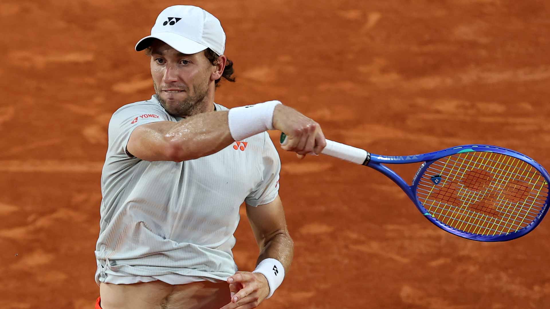Casper Ruud survives Tommy Paul 4-6, 6-7(4), 6-4, 7-6(4), 7-5 on Friday at Roland Garros.