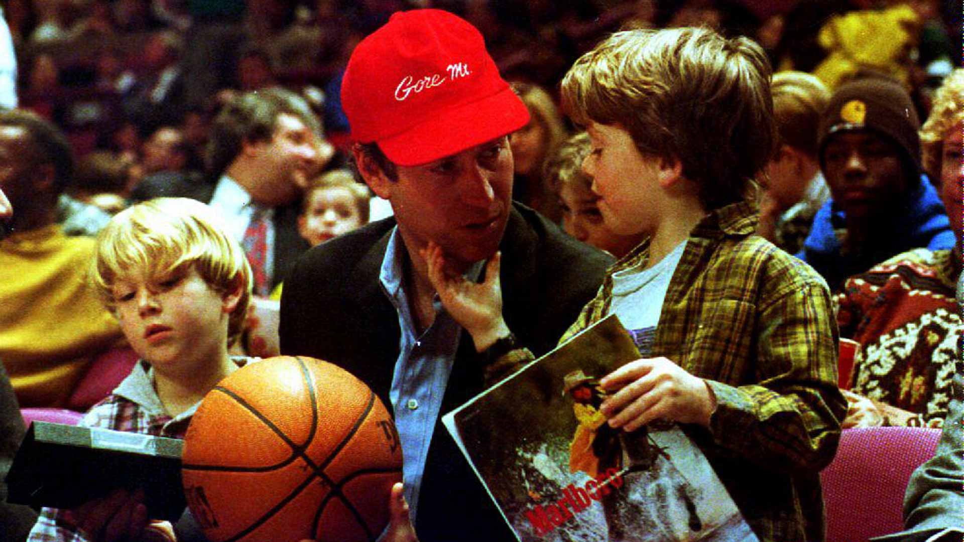 <a href='https://www.atptour.com/en/players/john-mcenroe/m047/overview'>John McEnroe</a> attends a Knicks game in 1994 with his sons Kevin (left) and Sean (right).