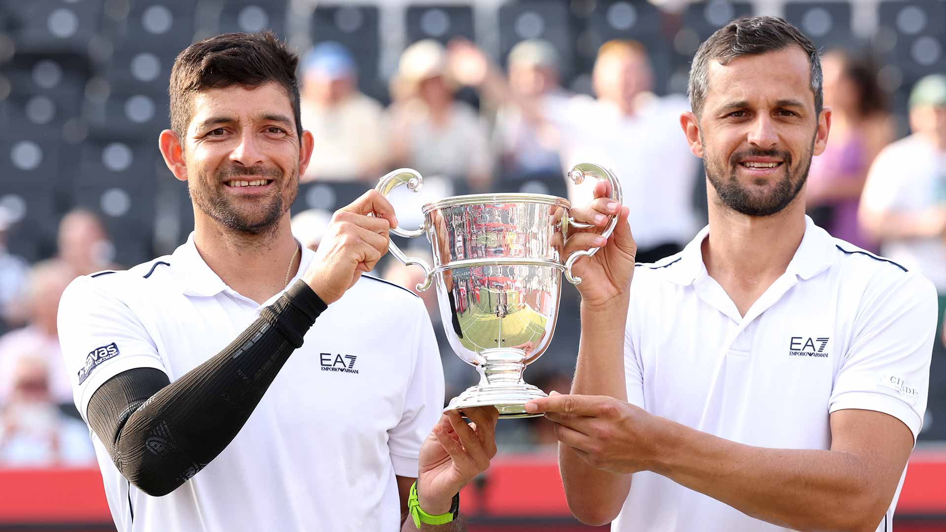 Marcelo Arevalo and Mate Pavic lift the trophy at The Queen's Club.