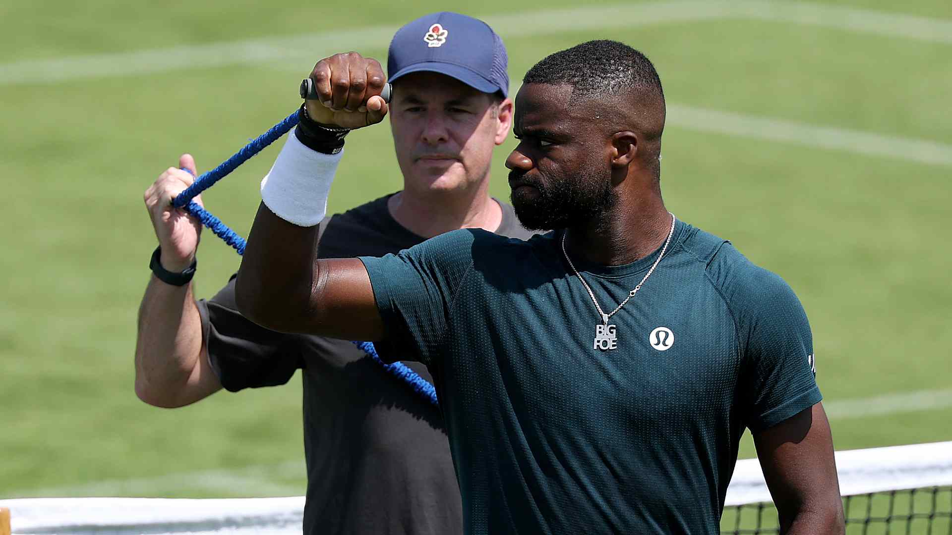 <a href='https://www.atptour.com/en/players/frances-tiafoe/td51/overview'>Frances Tiafoe</a> practising with coach <a href='https://www.atptour.com/en/players/mark-kovacs/kb22/overview'>Mark Kovacs</a> on Tuesday at <a href='https://www.atptour.com/en/tournaments/wimbledon/540/overview'>Wimbledon</a>.