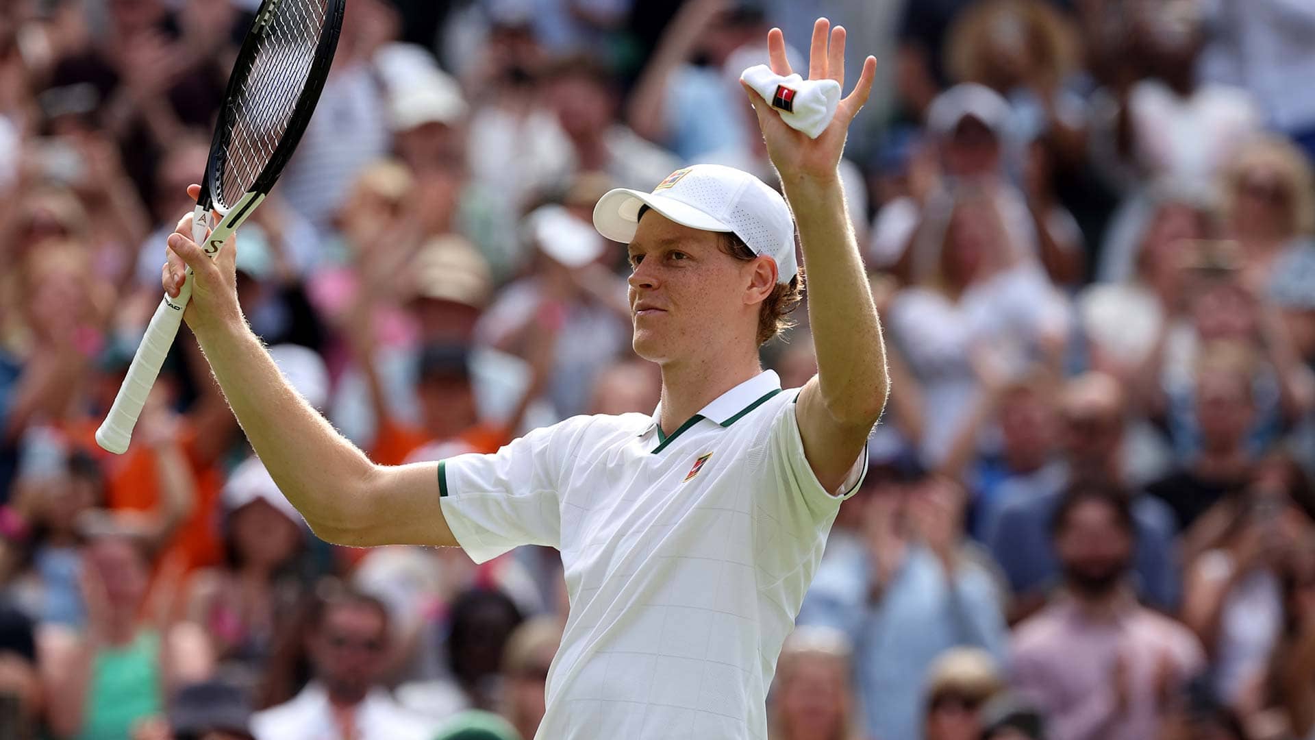 Jannik Sinner celebrates winning in five sets against Miomir Kecmanovic on Monday at Wimbledon.