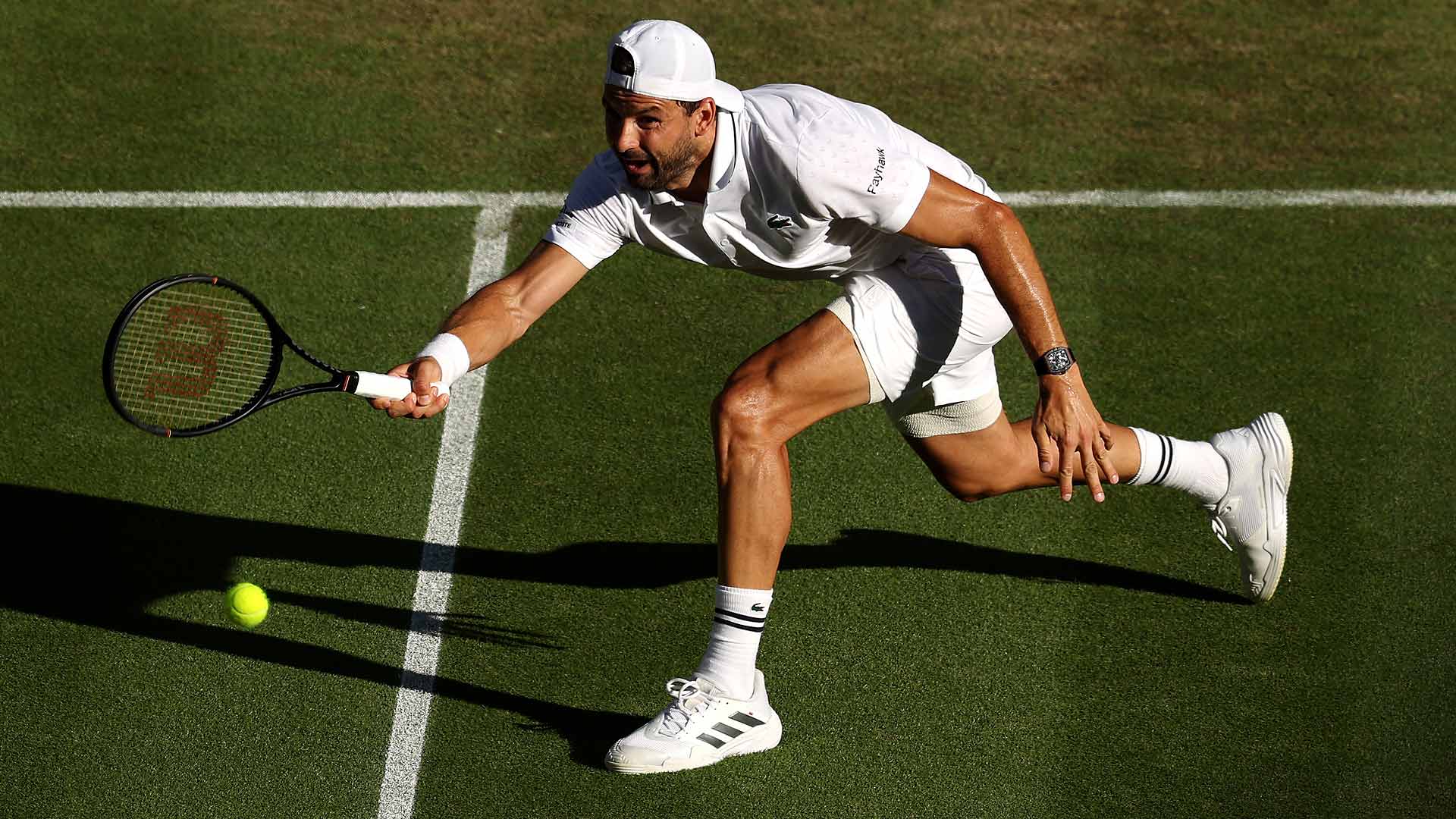 Grigor Dimitrov defeats Matteo Berrettini in five sets on Saturday at Wimbledon.