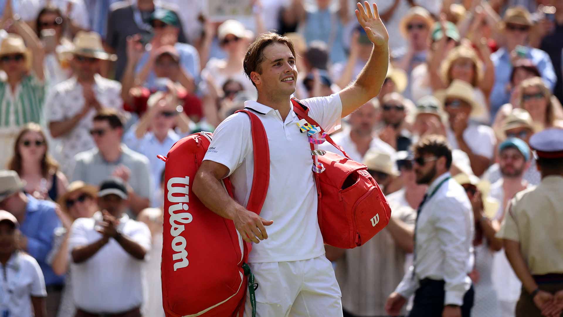 Arthur Fery waves goodbye to the Centre Court crowd after competing in his first major semi-final.