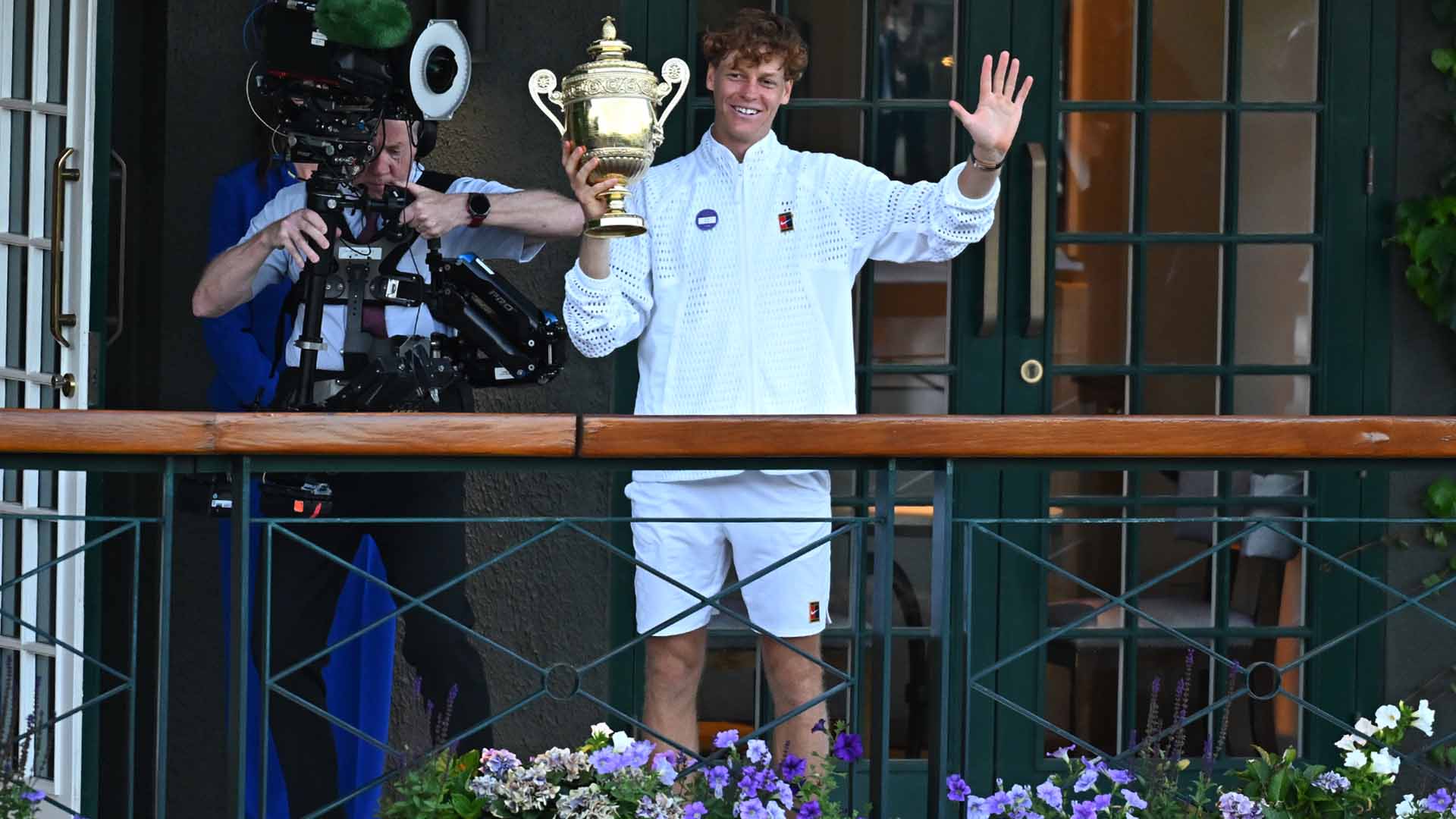 Jannik Sinner celebrates after winning his second Wimbledon title on Sunday at SW19.