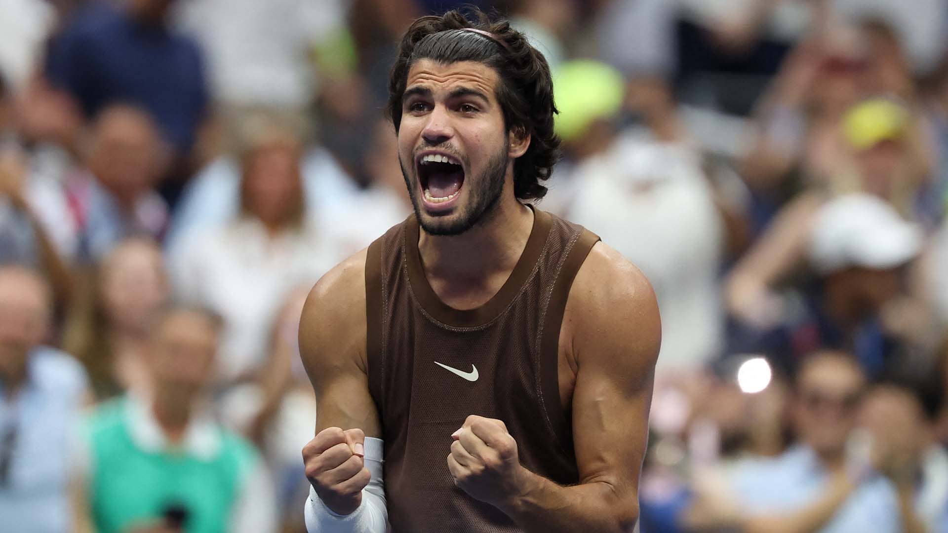 Carlos Alcaraz defeats Roman Safiullin on Monday to reach the second round at the US Open.