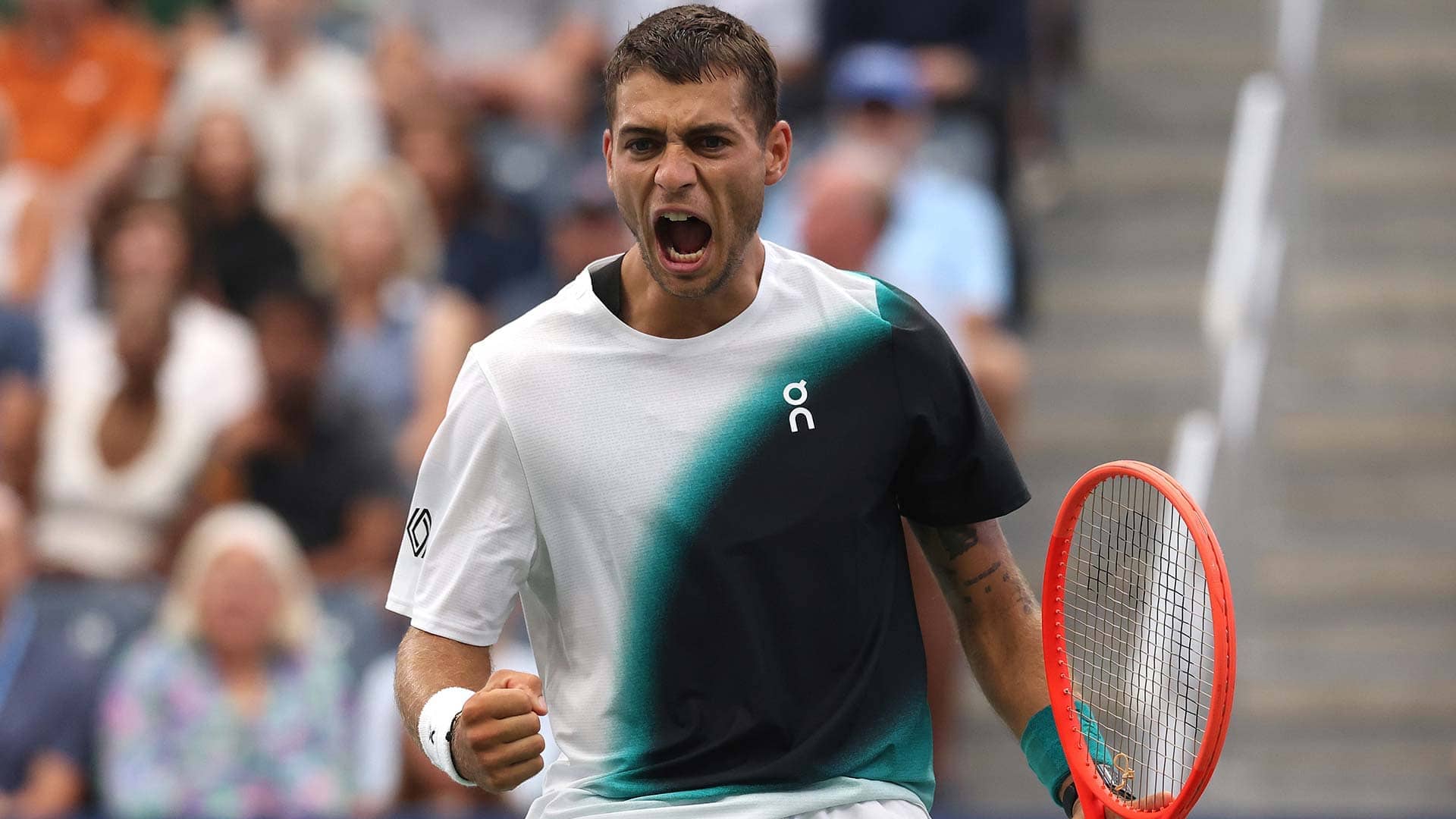 Flavio Cobolli celebrates coming back from two sets to love down for the first time in his career.