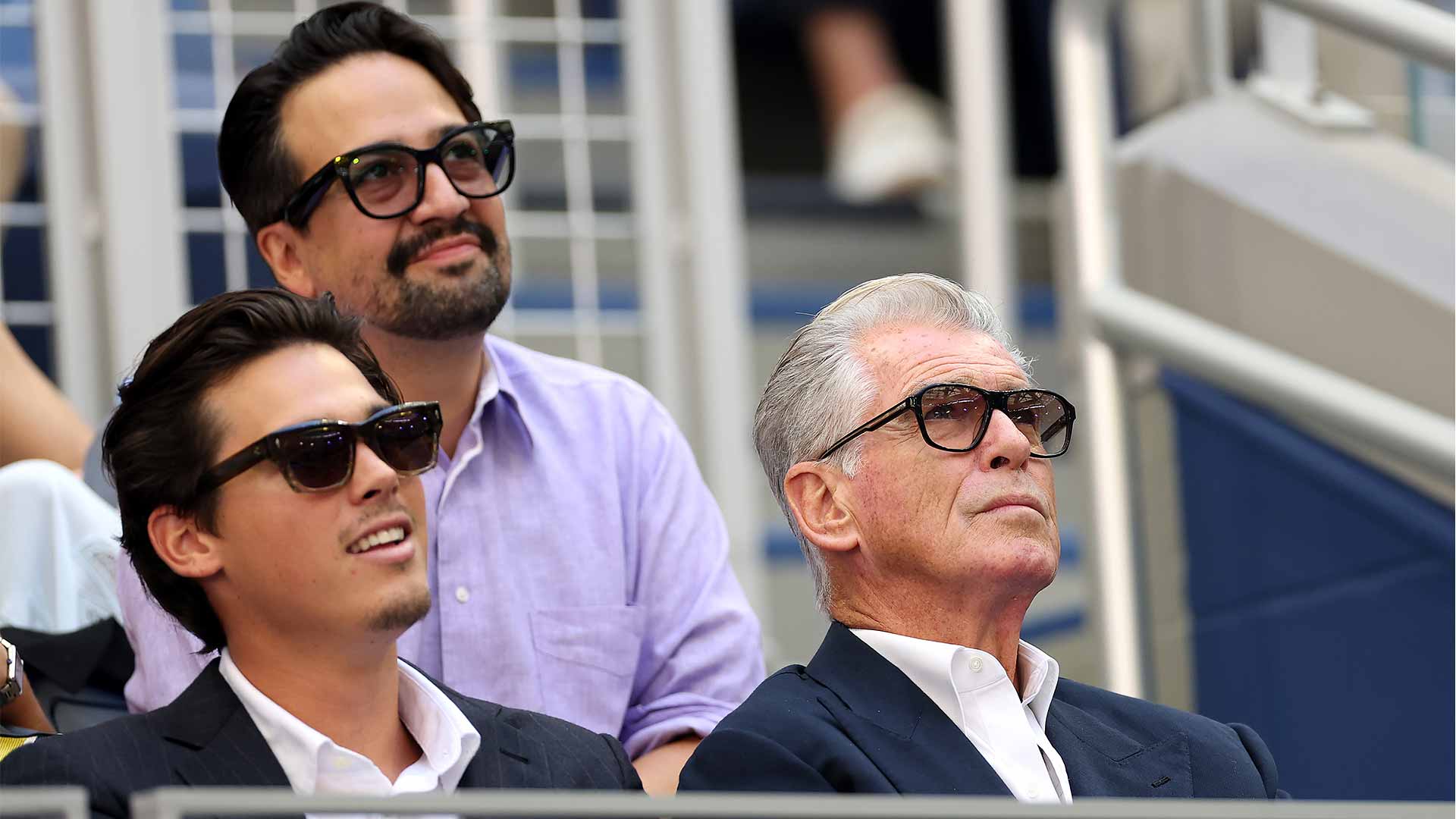Lin-Manuel Miranda and Pierce Brosnan in attendance at the <a href='https://www.atptour.com/en/tournaments/us-open/560/overview'>US Open</a> final Sunday.