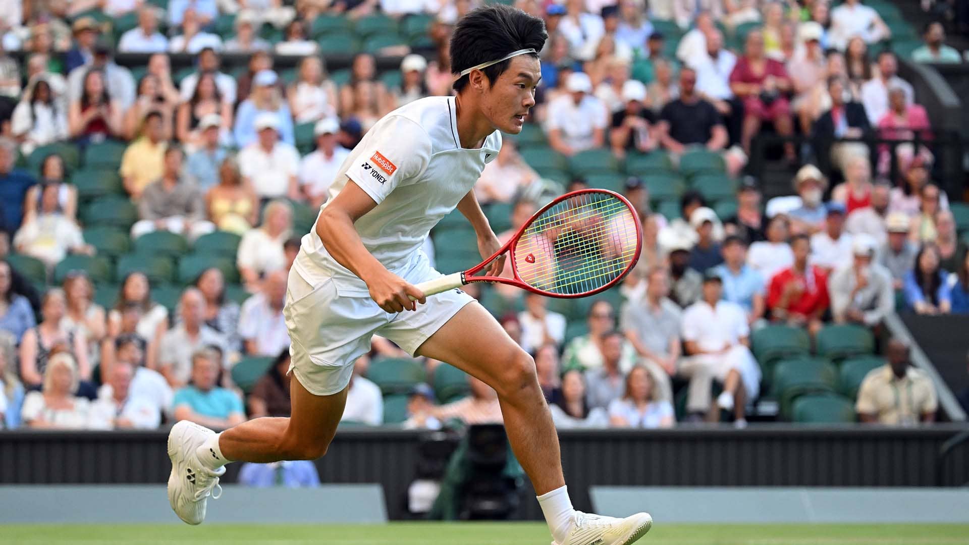 <a href='https://www.atptour.com/en/players/michael-zheng/z0bz/overview'>Michael Zheng</a> competes at <a href='https://www.atptour.com/en/tournaments/wimbledon/540/overview'>Wimbledon</a>'s Centre Court in July.
