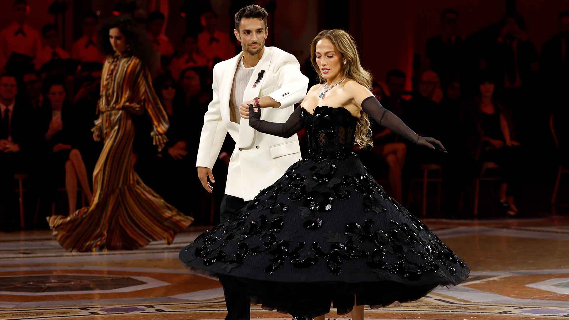 Lorenzo Musetti and Jennifer Lopez share the runway at Vogue World in Milan. 