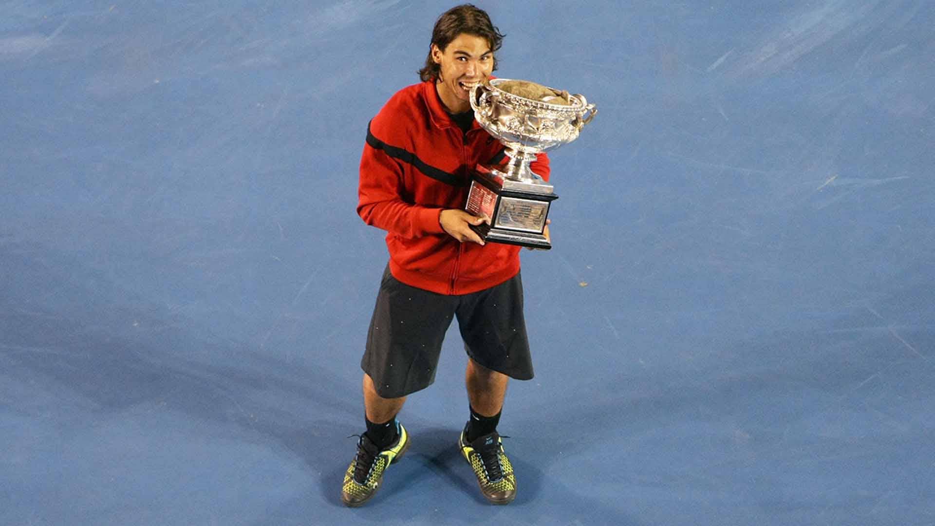 Rafael Nadal overcomes Roger Federer 7-5, 3-6, 7-6(3), 3-6, 6-2 to win his first Australian Open title.